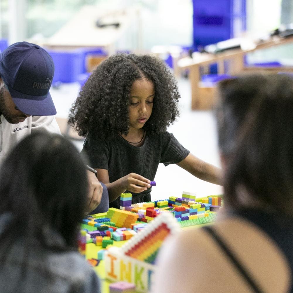 kids playing with manipulatives at Pacific Science Center