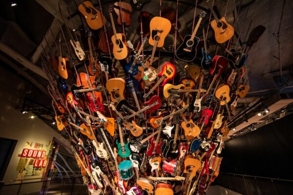MoPOP display with hundreds of guitars in a jumble